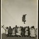 An Inuit woman celebrating the spring whale catch by blanket tossing Point Barrow, Alaska. The woman jumps from an elastic walrus skin held by her fellow celebrators. 1921. Via National Museum of Denmark.